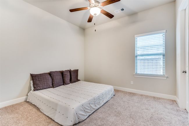 Bedroom featuring carpet, baseboards, and ceiling fan | Image 18