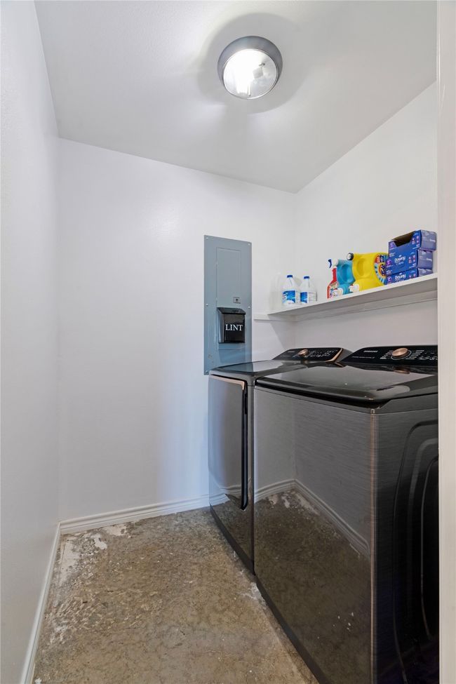 Washroom with separate washer and dryer, electric panel, baseboards, and laundry area | Image 19