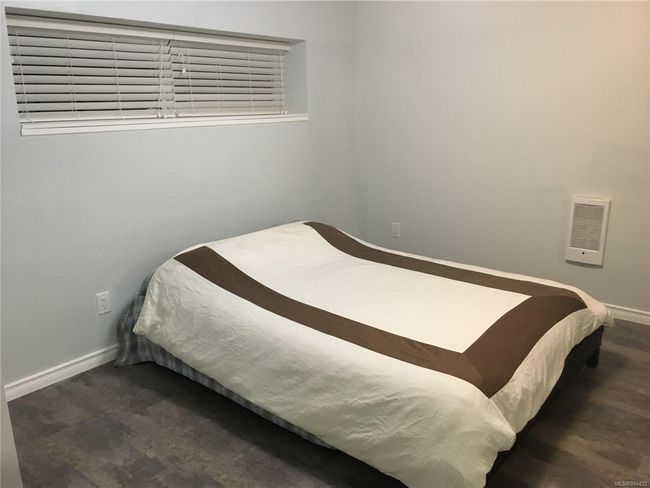Bedroom featuring visible vents and baseboards | Image 23