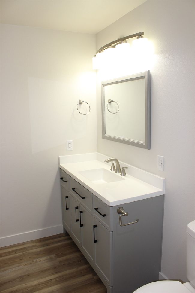 Bathroom with vanity and wood finished floors | Image 16