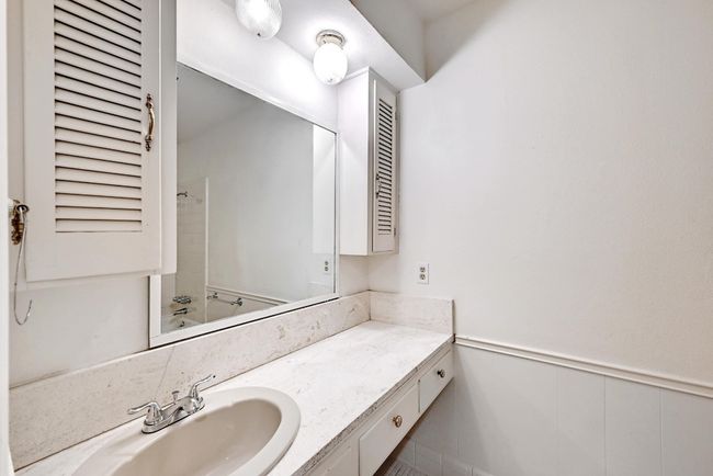 Full bathroom with shower / bath combination, vanity, and wainscoting | Image 23