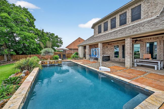 View of pool featuring a patio area and a fenced backyard | Image 38