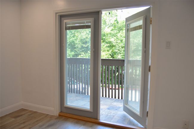Entryway featuring baseboards and finished floors | Image 4