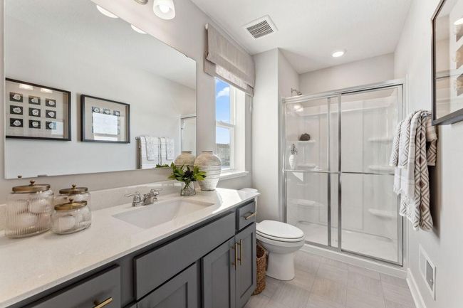 The 3/4 bath found in the upstairs secondary suite. Photo of model home, colors and finishes will vary. | Image 23