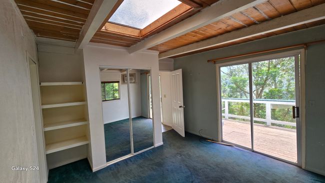 Secondary Bedroom with Lawai Valley Views from wrap-around deck. | Image 16