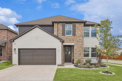 View of front of property with a garage and a front lawn | Image 1