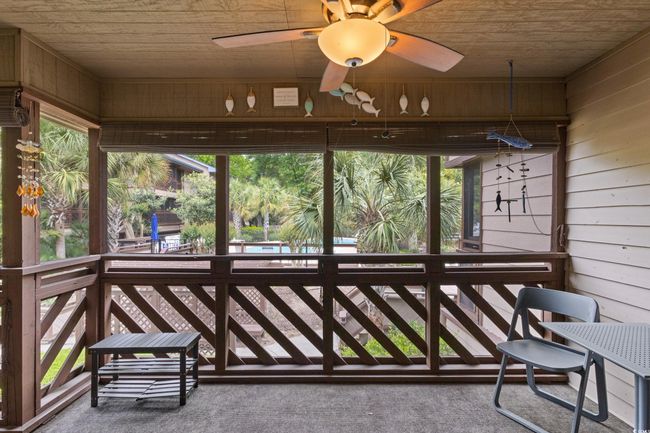 Sunroom / solarium featuring a ceiling fan | Image 34