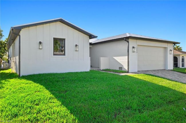 View of front of house with a garage and a front lawn | Image 40