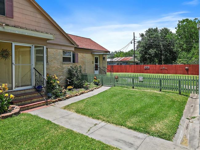 The side entrance to the home takes you directly to the den. | Image 5