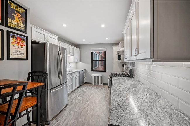 Modern lighting, lots of counterspace and room for a breakfast table! | Image 18