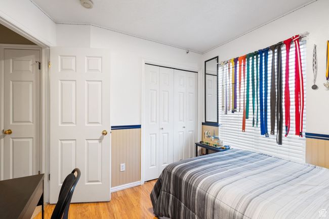 Bedroom featuring light hardwood / wood-style floors and a closet | Image 25