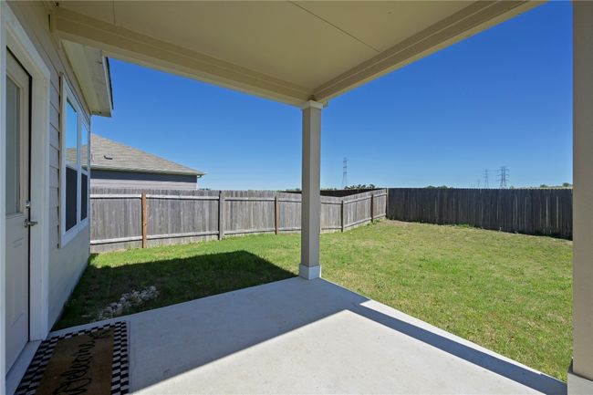View of yard featuring a fenced backyard and a patio | Image 35