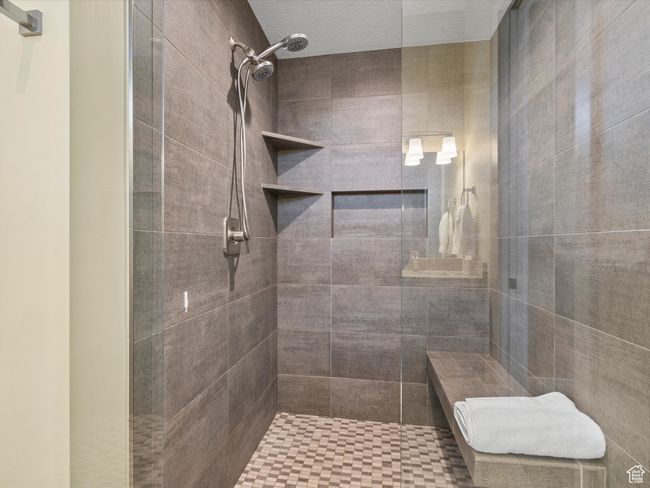 Bathroom featuring tiled shower | Image 10