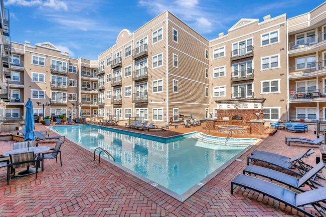 Enjoy sun-soaked days by the sparkling pool, complete with lounge chairs, shaded seating, and a relaxing atmosphere—right outside your door. | Image 17