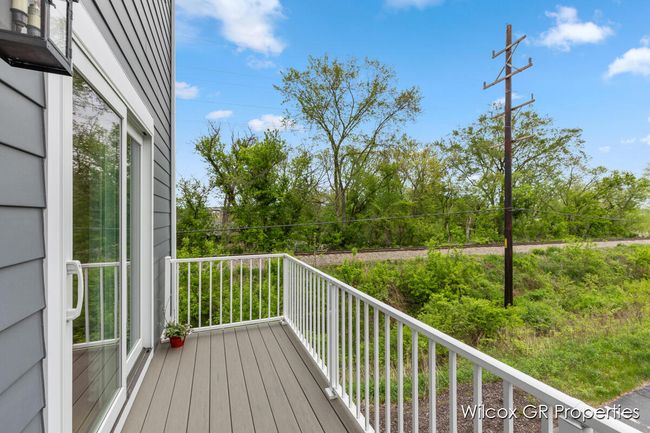 Expansive deck is the perfect spot with custom gas line to grill, maintenance free trex deck, and metal rails. | Image 38