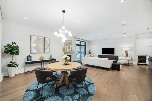 [Dining/Living Area] Dining area with chic pendant lighting, perfect space for large gatherings or intimate dining | Image 9