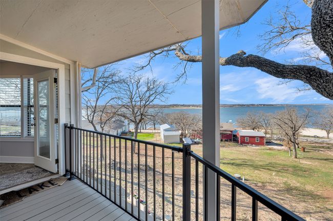 Wooden terrace featuring a water view | Image 12