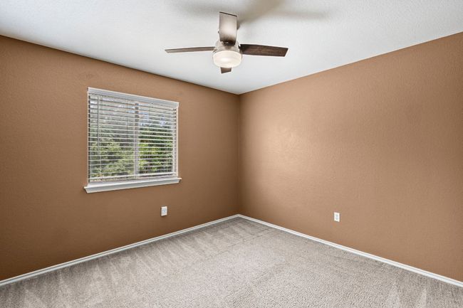 Carpeted spare room with ceiling fan and baseboards | Image 20