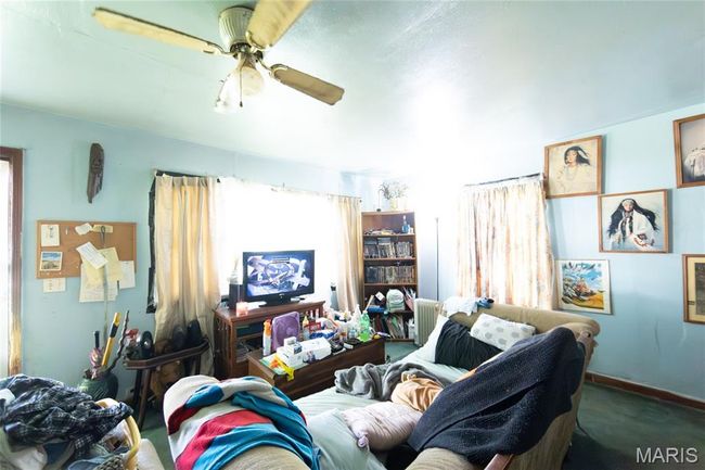 Living area featuring plenty of natural light and ceiling fan | Image 16