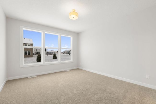 Enjoy the tranquility of this large master bedroom, complete with a large closet, bright windows, and a soothing atmosphere perfect for unwinding after a long day. | Image 20