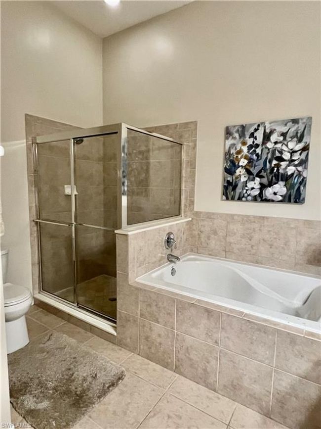 Closer view of shower and tub before accessories were removed | Image 25