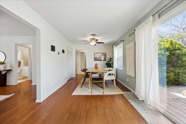 Dining area featuring baseboards, wood finished floors, and a ceiling fan | Image 10