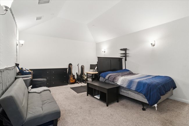 Upstairs media room, currently being used as a bedroom. | Image 33