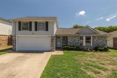 View of front of home featuring a front lawn and a garage | Image 2