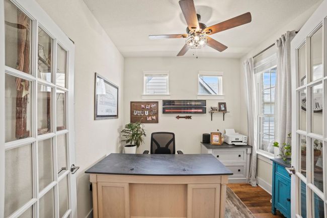 Office area with a ceiling fan, baseboards, and dark wood-type flooring | Image 6