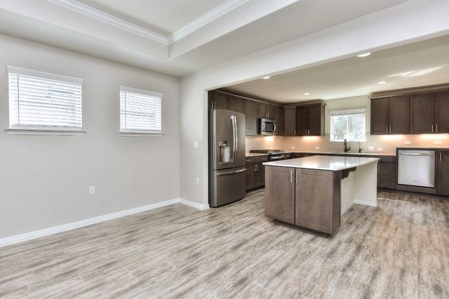 Kitchen has under counter lighting. | Image 16