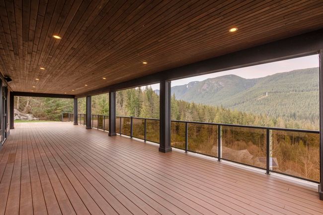 Wooden deck featuring a wooded view and a mountain view | Image 36