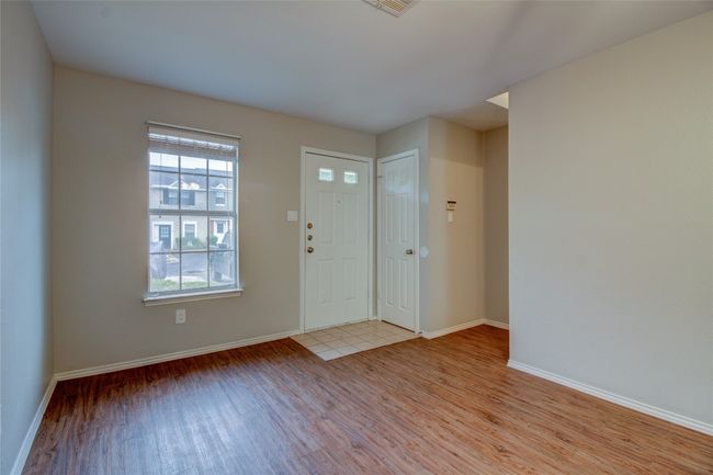 Foyer entrance with light wood-style floors and baseboards | Image 12