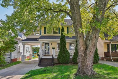 View of front of house featuring covered porch and a front yard | Image 2