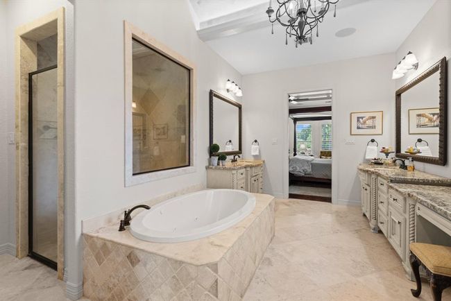 The entrance to the over-sized shower is hidden behind the jacuzzi tub... | Image 33