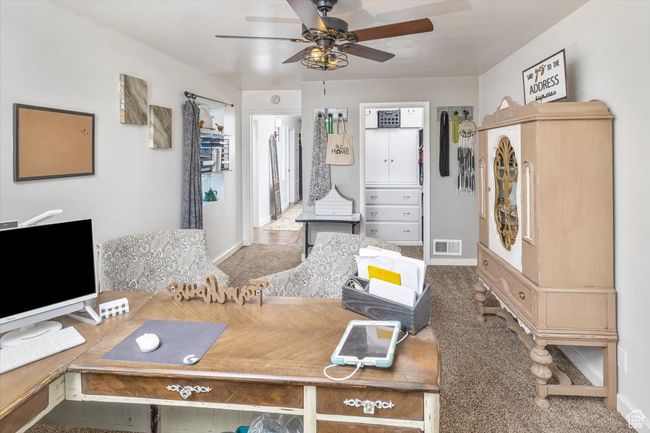 Interior space with carpet flooring and ceiling fan | Image 18