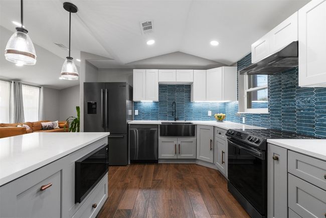 With updated appliances, the kitchen offers everything you need to whip up a feast or try out a new recipe, all while complimenting the home’s bold and contemporary design | Image 12