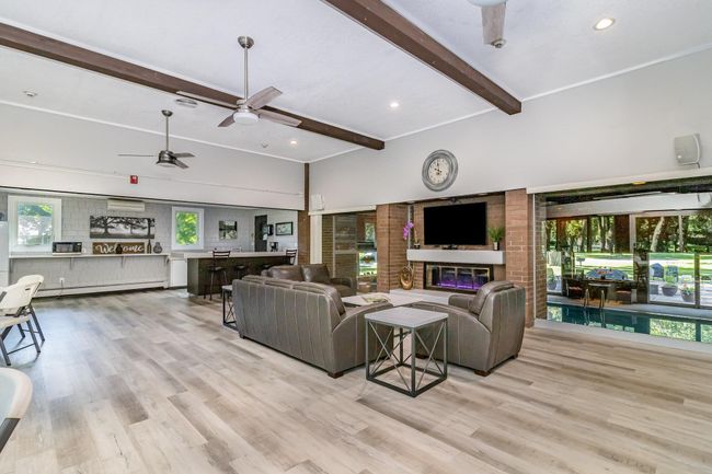 The building's party room is available for residents and includes a kitchenette, big-screen TV, fireplace and plenty of seating. | Image 18