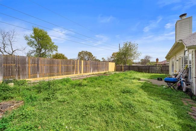 Step into the expansive backyard offering plenty of space for entertaining, play, or future outdoor enhancements. With no rear neighbors, this outdoor space feels private and full of potential. | Image 31