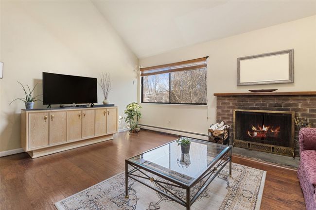 The spacious living room offers plenty of space, hardwood floors and great light | Image 9