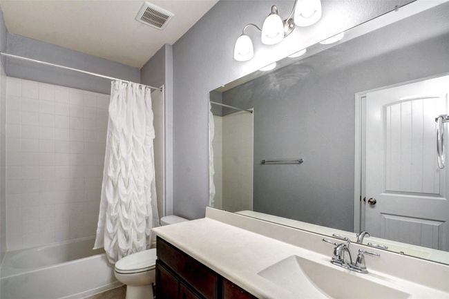 An extended vanity in the secondary bath makes sharing a little easier. | Image 23