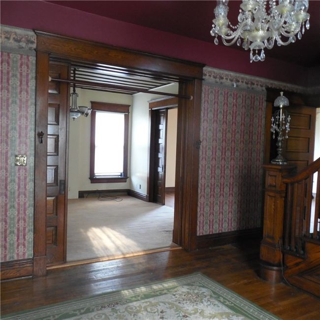 Pocket doors leading into the living room | Image 9