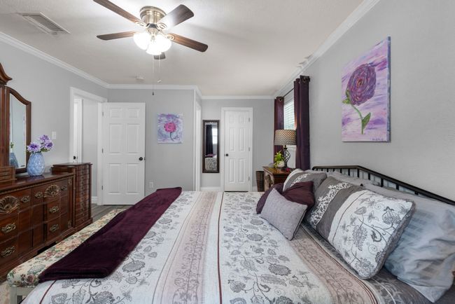 Bedroom featuring crown molding and a ceiling fan | Image 12