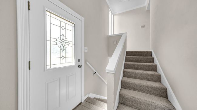 Foyer entrance featuring plenty of natural light and tile patterned floors | Image 5