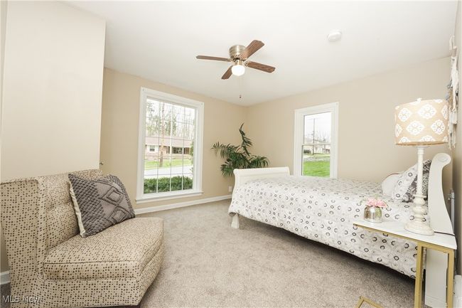 Bedroom featuring baseboards, carpet floors, and ceiling fan | Image 23