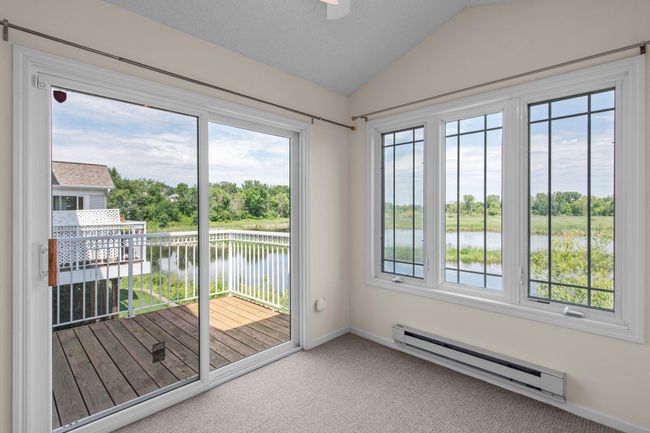 Beautiful views of nature abound from the back of this home from the 4-season sunroom | Image 10