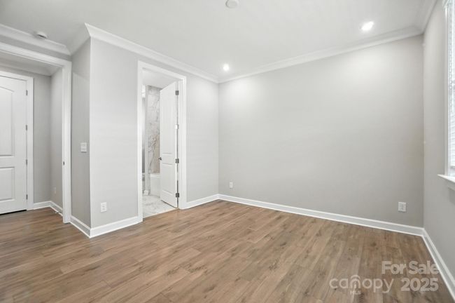 Bedroom 2 with view into en suite Bath | Image 6