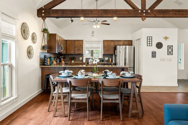 Dining area featuring ceiling fan and light wood-style floors | Image 11