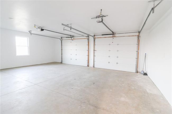 Garage with a garage door opener | Image 45