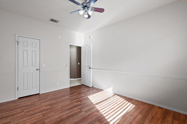Secondary bedroom with ceiling fan | Image 27