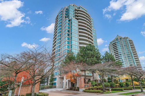 Contemporary high-rise architecture featuring extensive fenestration | Card Image